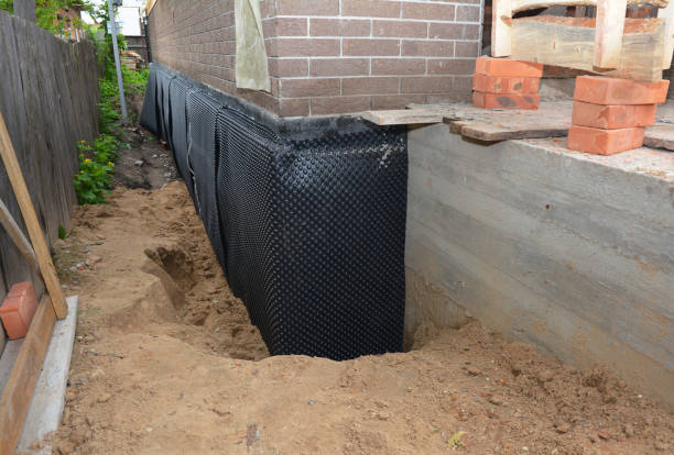 Happy homeowners after waterproofing job in Bethel